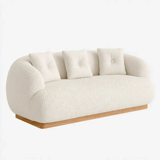Sofá beige con respaldo curvo y base continua de la marca modularsofahaven, ideal para salas modernas y confortables.