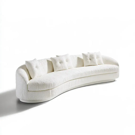 Sofá curvado beige de la marca modularsofahaven con cojines decorativos, estilo moderno y cómodo para sala de estar.
